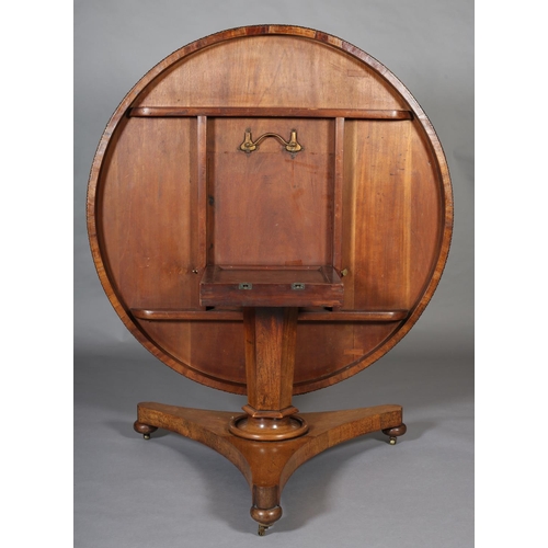 372 - A MID 19TH CENTURY ROSEWOOD BREAKFAST TABLE, having a circular tilt top with bead and reel to the fr... 