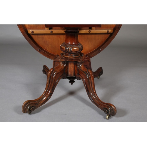 387 - A VICTORIAN LOOE TABLE, having an oval tilt top, on short lobed column and quadruple base with hippe... 