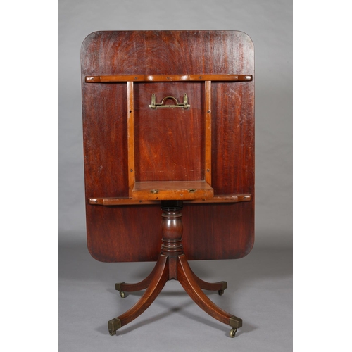 370 - AN EARLY 19TH CENTURY MAHOGANY BREAKFAST TABLE having a rectangular tilt top with rounded corners, o... 