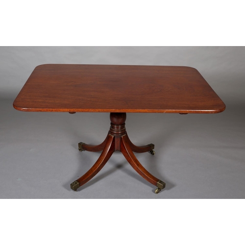 370 - AN EARLY 19TH CENTURY MAHOGANY BREAKFAST TABLE having a rectangular tilt top with rounded corners, o... 