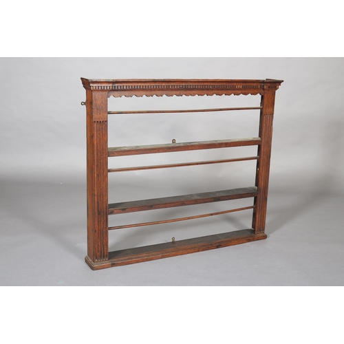 426 - A GEORGE III OAK DELFT RACK OF SMALL PROPORTIONS, having an moulded dentil cornice with bracketed fr... 