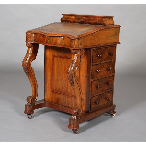 389 - A MID VICTORIAN WALNUT DAVENPORT, with raised stationery compartment, leather incised fall front of ... 