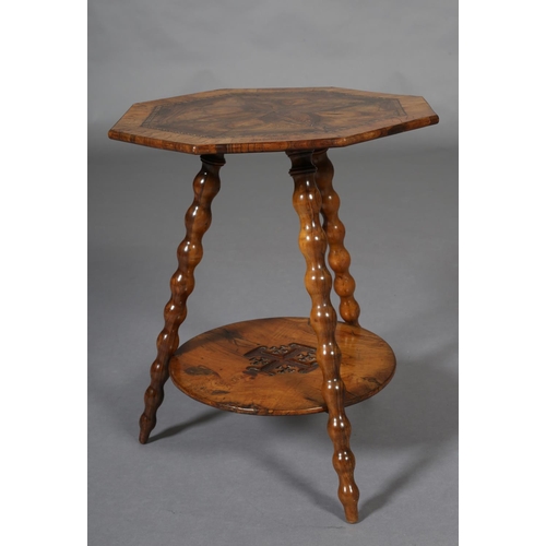 392 - A LATE 19TH CENTURY JERUSALEM OLIVE WOOD OCCASIONAL TABLE, of octagonal outline, the surface of mirr... 