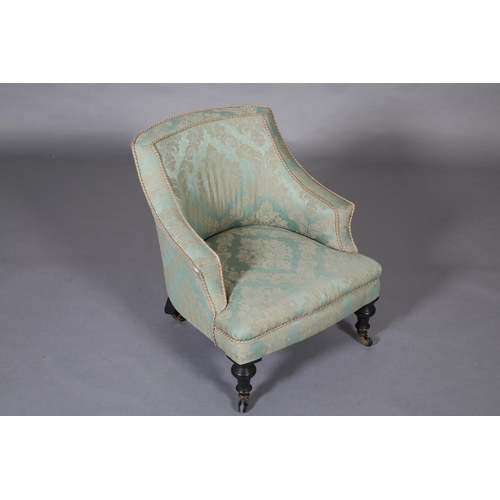 400 - A VICTORIAN PALE GREEN UPHOLSTERED NURSING CHAIR, on turned ebonised legs with castors