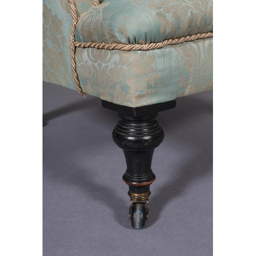 400 - A VICTORIAN PALE GREEN UPHOLSTERED NURSING CHAIR, on turned ebonised legs with castors