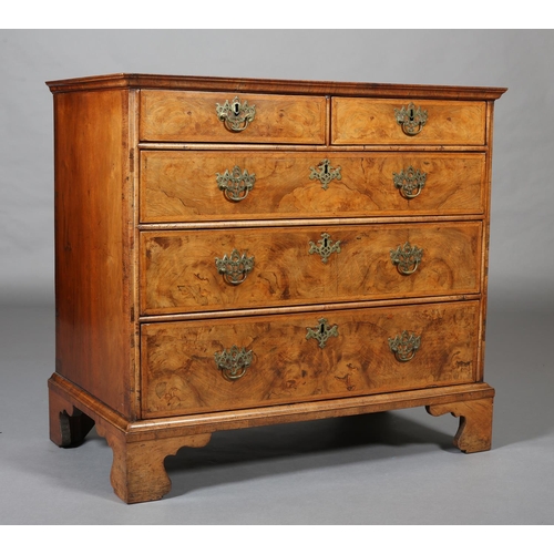 363 - AN 18TH CENTURY FIGURED WALNUT CHEST OF DRAWERS, the top quarter veneered and crossbanded with chevr... 