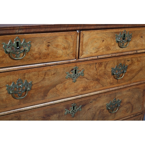 363 - AN 18TH CENTURY FIGURED WALNUT CHEST OF DRAWERS, the top quarter veneered and crossbanded with chevr... 