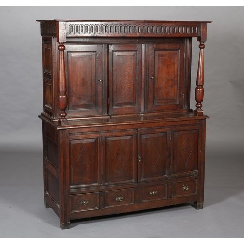 428 - AN OAK COURT CUPBOARD, 17th century and later having an arcaded frieze above a recessed cupboard of ... 