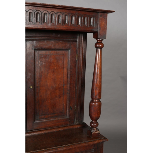 428 - AN OAK COURT CUPBOARD, 17th century and later having an arcaded frieze above a recessed cupboard of ... 