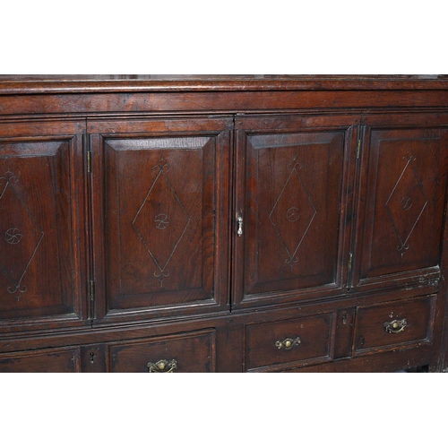 428 - AN OAK COURT CUPBOARD, 17th century and later having an arcaded frieze above a recessed cupboard of ... 