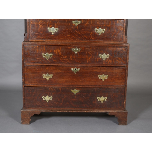 429 - A GEORGE III OAK CHEST ON CHEST, having a moulded cornice and dentil cornice above two short and thr... 