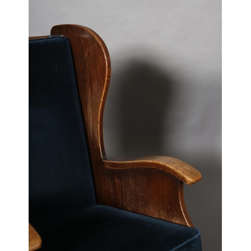 415 - A PAIR OF MID-20TH CENTURY ARTS & CRAFTS STYLE ELM WINGED ARMCHAIRS, having a pegged planked back, c... 