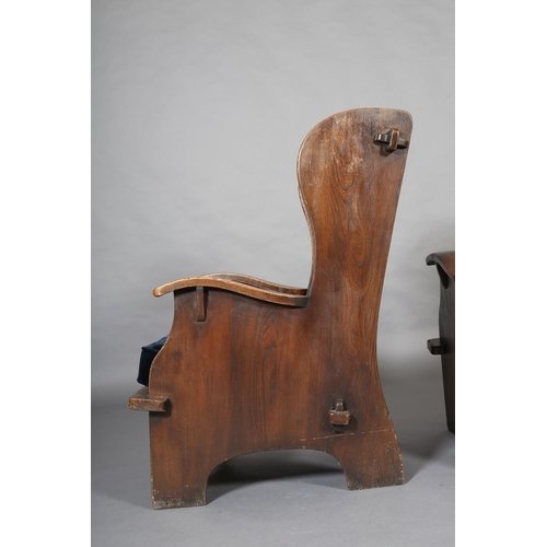 415 - A PAIR OF MID-20TH CENTURY ARTS & CRAFTS STYLE ELM WINGED ARMCHAIRS, having a pegged planked back, c... 