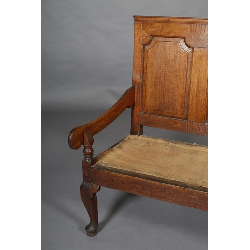 424 - A GEORGE III OAK SETTLE OF SMALL PROPORTIONS having a triple field panel back, slab arms, on cabriol... 