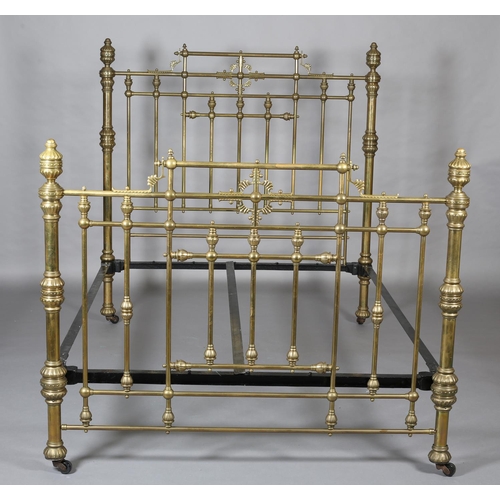 419 - A VICTORIAN BRASS BED having railed head and foot, with fanned and beaded decoration, cup and cover ... 