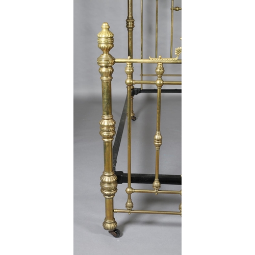 419 - A VICTORIAN BRASS BED having railed head and foot, with fanned and beaded decoration, cup and cover ... 