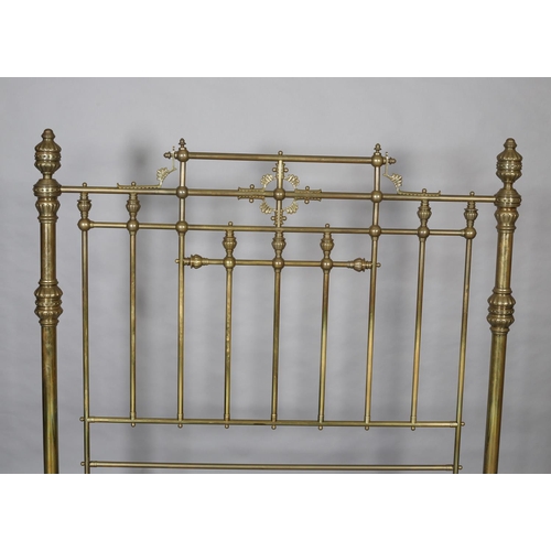 419 - A VICTORIAN BRASS BED having railed head and foot, with fanned and beaded decoration, cup and cover ... 