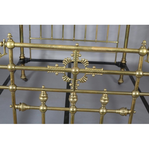 419 - A VICTORIAN BRASS BED having railed head and foot, with fanned and beaded decoration, cup and cover ... 