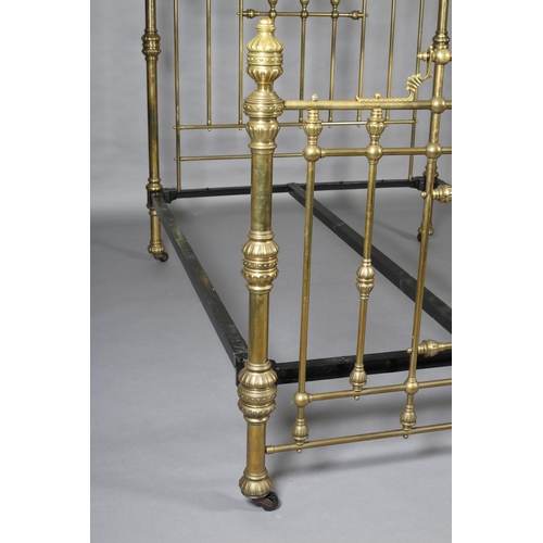 419 - A VICTORIAN BRASS BED having railed head and foot, with fanned and beaded decoration, cup and cover ... 