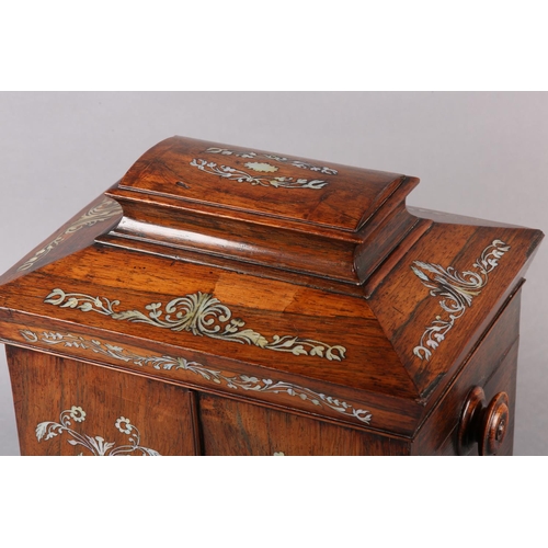 78 - A LATE REGENCY ROSEWOOD AND MOTHER-OF-PEARL INLAID CASKET, with sarcophagus lift up lid over two doo... 