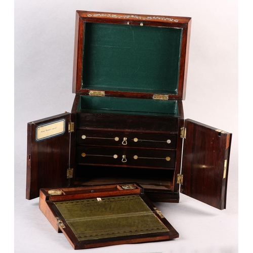 78 - A LATE REGENCY ROSEWOOD AND MOTHER-OF-PEARL INLAID CASKET, with sarcophagus lift up lid over two doo... 