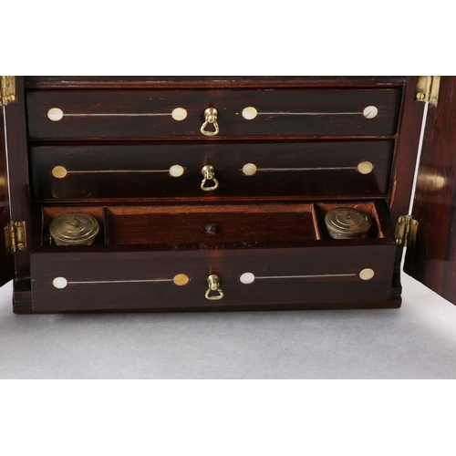 78 - A LATE REGENCY ROSEWOOD AND MOTHER-OF-PEARL INLAID CASKET, with sarcophagus lift up lid over two doo... 