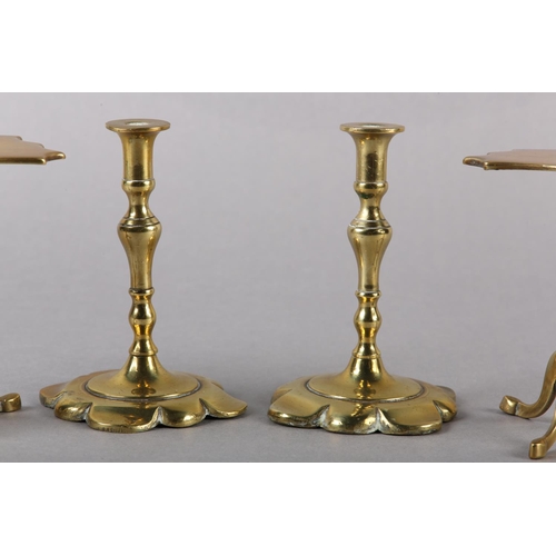 56 - A PAIR OF EARLY 19TH CENTURY BRASS CANDLESTICKS, inverted baluster stem and petalated square base, 1... 