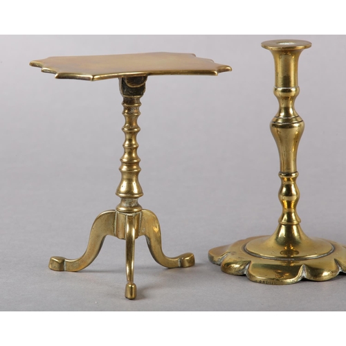 56 - A PAIR OF EARLY 19TH CENTURY BRASS CANDLESTICKS, inverted baluster stem and petalated square base, 1... 