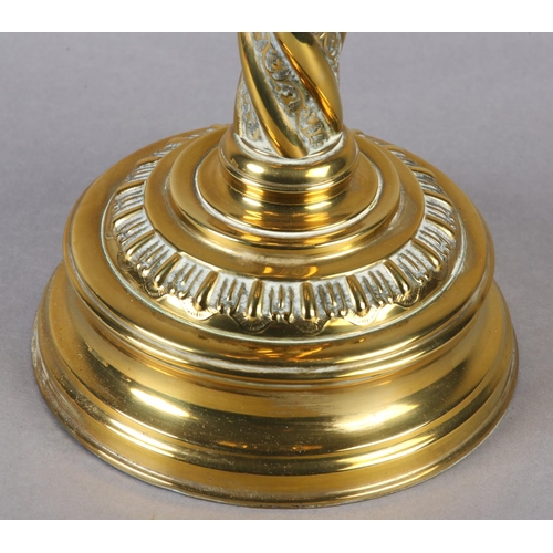 14 - A VICTORIAN BRASS OIL LAMP, with wrythen lobed reservoir and wrythen column on circular stepped base... 