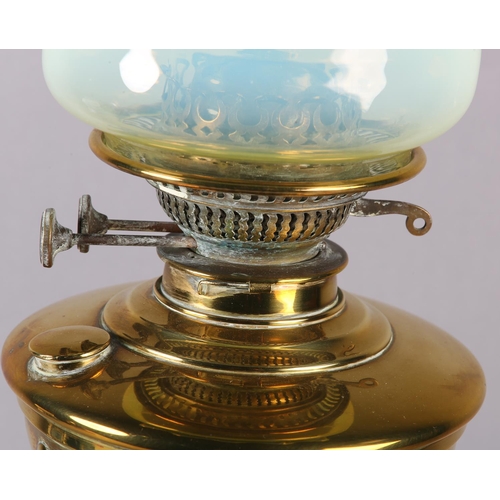 14 - A VICTORIAN BRASS OIL LAMP, with wrythen lobed reservoir and wrythen column on circular stepped base... 