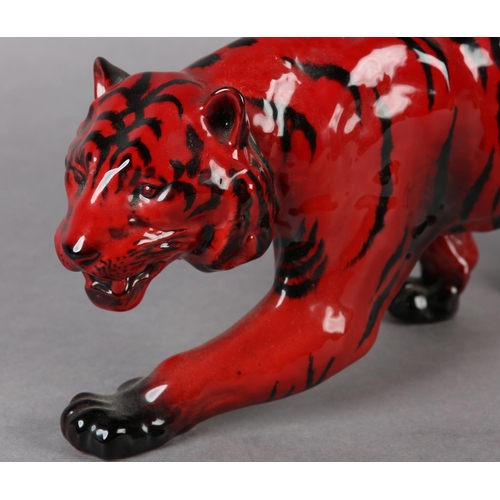 89 - A ROYAL DOULTON VEINED FLAMBE FIGURE OF A TIGER, modelled stalking, marked to the front left paw wit... 