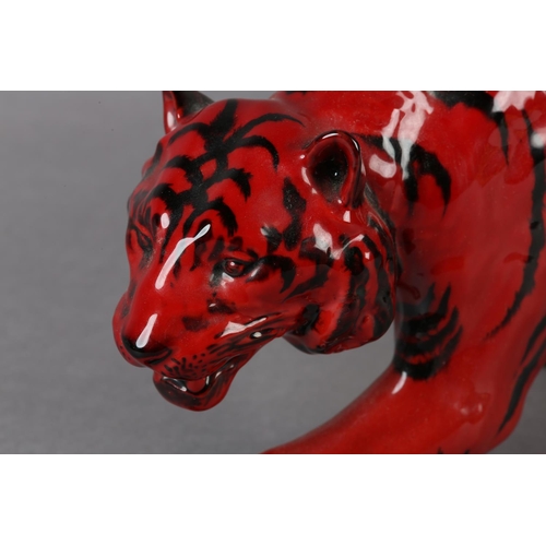 89 - A ROYAL DOULTON VEINED FLAMBE FIGURE OF A TIGER, modelled stalking, marked to the front left paw wit... 