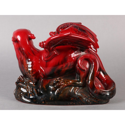 90 - A ROYAL DOULTON VEINED FLAMBE FIGURE OF A DRAGON, modelled on a rock, marked to the front left paw w... 