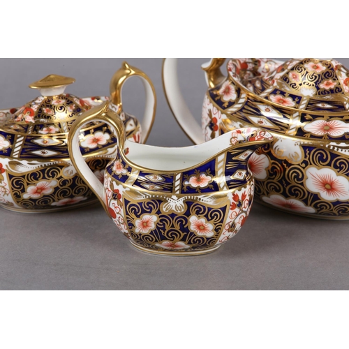 98 - A ROYAL CROWN DERBY IMARI TEA SERVICE comprising teapot and milk jug dated 1909 and twin handled sug... 