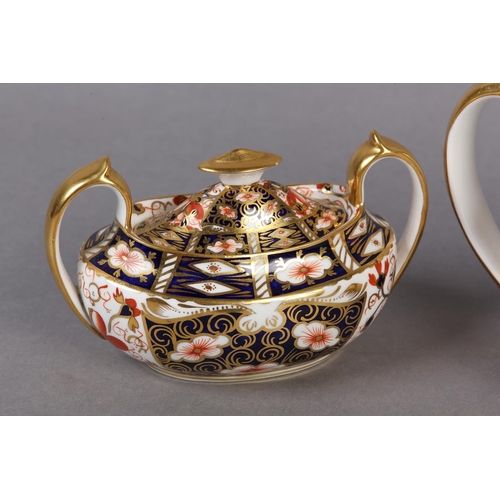 98 - A ROYAL CROWN DERBY IMARI TEA SERVICE comprising teapot and milk jug dated 1909 and twin handled sug... 