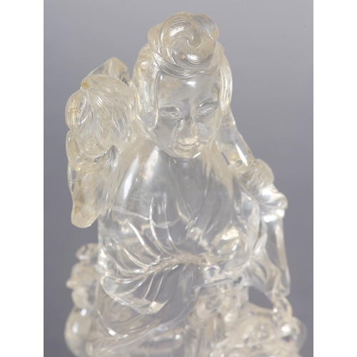 124 - A CHINESE ROCK CRYSTAL FIGURE OF THE IMMORTAL MAGU, holding a fruiting branch, a deer at her feet, 1... 