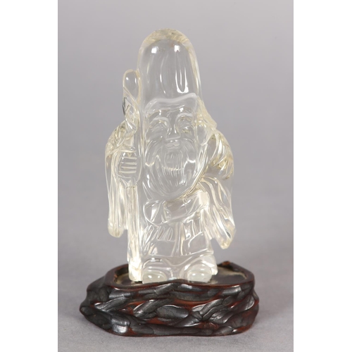 125 - A CHINESE ROCK CRYSTAL FIGURE OF LOHAN, 10.5cm high with hardwood stand