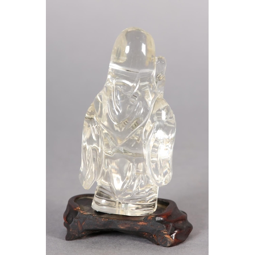 125 - A CHINESE ROCK CRYSTAL FIGURE OF LOHAN, 10.5cm high with hardwood stand