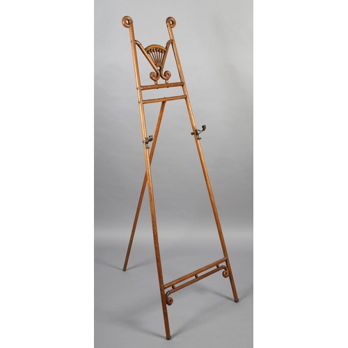 416 - A SECESSIONIST MOVEMENT ELM SALON EASEL, with curled finials, fanned bobbin panel and scrolled metal... 