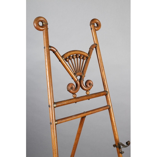 416 - A SECESSIONIST MOVEMENT ELM SALON EASEL, with curled finials, fanned bobbin panel and scrolled metal... 