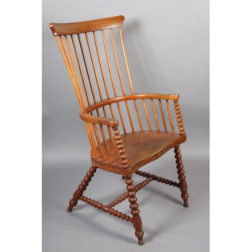 423 - A LATE VICTORIAN ELM AND FRUITWOOD HIGH RAIL BACK ARMCHAIR, broad seat, on bobbin turned legs and st... 