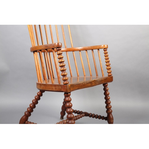 423 - A LATE VICTORIAN ELM AND FRUITWOOD HIGH RAIL BACK ARMCHAIR, broad seat, on bobbin turned legs and st... 