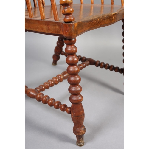 423 - A LATE VICTORIAN ELM AND FRUITWOOD HIGH RAIL BACK ARMCHAIR, broad seat, on bobbin turned legs and st... 