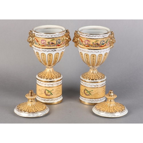 109 - A PAIR OF PEDESTAL VASES AND COVERS of urn form, fluted covers with knopped finials above twin lion ... 