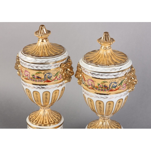 109 - A PAIR OF PEDESTAL VASES AND COVERS of urn form, fluted covers with knopped finials above twin lion ... 