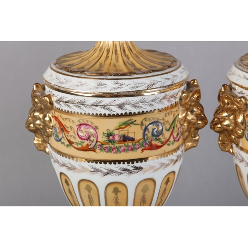 109 - A PAIR OF PEDESTAL VASES AND COVERS of urn form, fluted covers with knopped finials above twin lion ... 