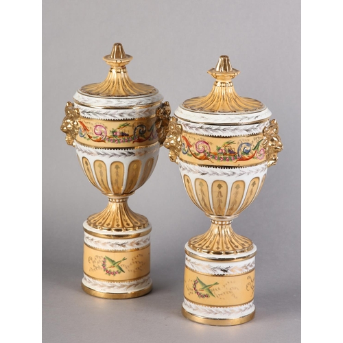 109 - A PAIR OF PEDESTAL VASES AND COVERS of urn form, fluted covers with knopped finials above twin lion ... 