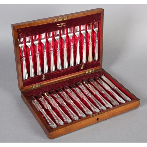 147 - AN EARLY 20TH CENTURY MAHOGANY CANTEEN OF TWELVE ENTRÉE KNIVES AND FORKS, by Walker & Hall, beaded h... 