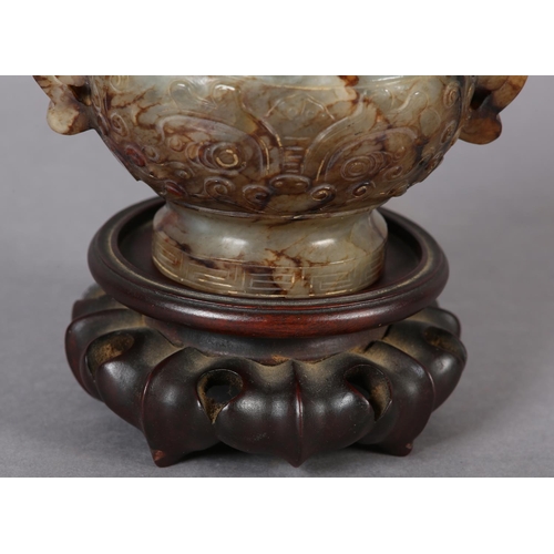 120 - A CHINESE CARVED HARDSTONE INCENSE BURNER AND COVER OF GREEN-BROWN COLOUR, having a domed and pierce... 