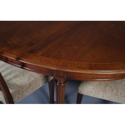 410 - A TITCHMARCH & GOODWIN MAHOGANY DINING SUITE, comprising an oval table on fluted and leaf capped leg... 